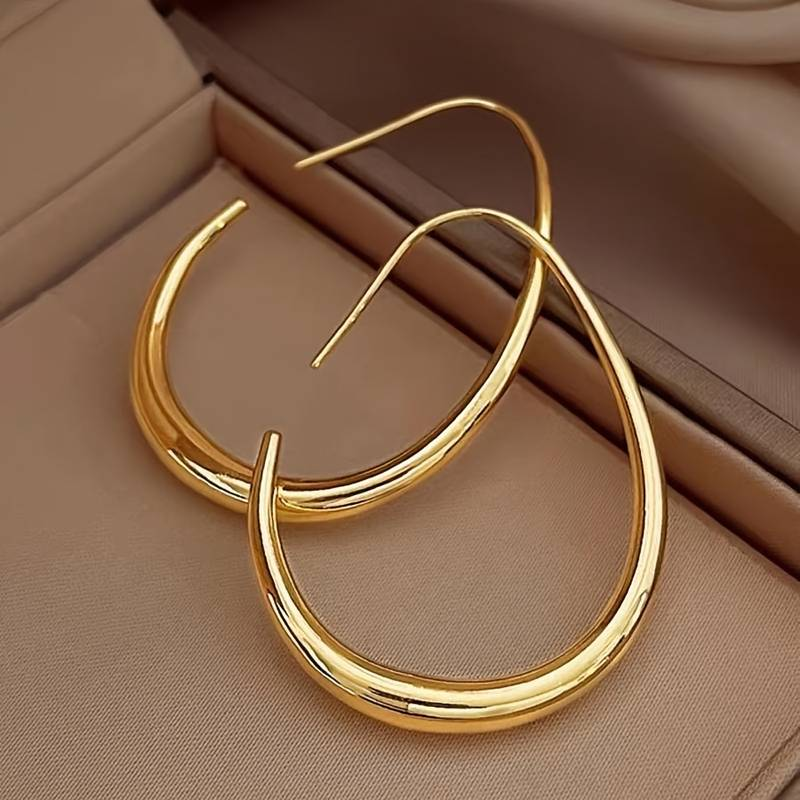 Boucles d'oreilles hoop sculptées en or | Forme goutte fluide